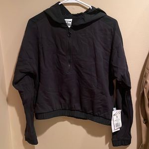 Reebok black hooded half- zip sweatshirt with windbreaker material hood.